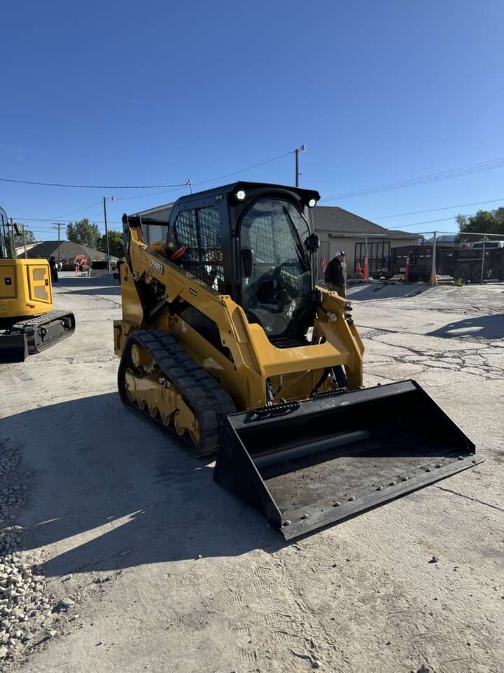 CAT track loader skid steer for rent. Enclosed cab, hand controls.