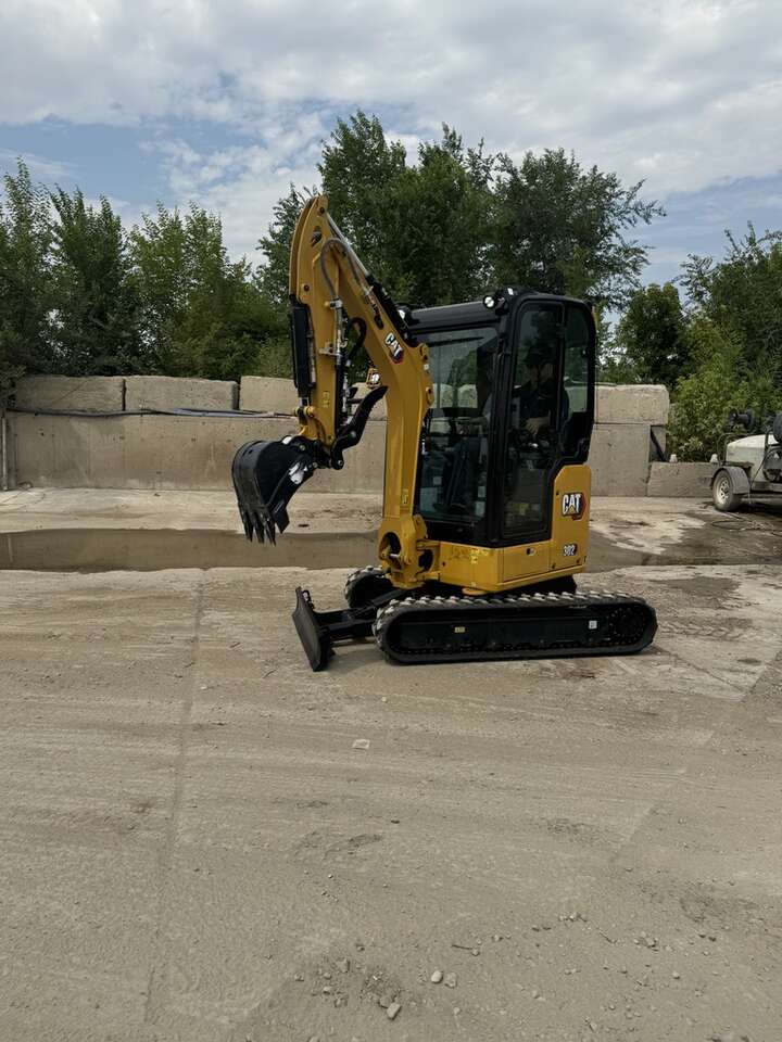 Compact mini excavator for rent. CAT 302. Only 4k lbs and 39 ins wide.