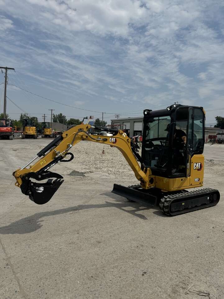 Special Promo! Small mini excavator for rent. Digs over 7', and fits through narrow gates!