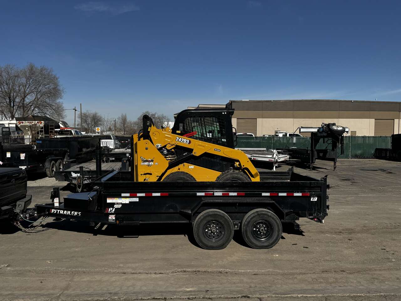 CAT 242D3 Wheel Skid Steer & Dump Trailer Combo
