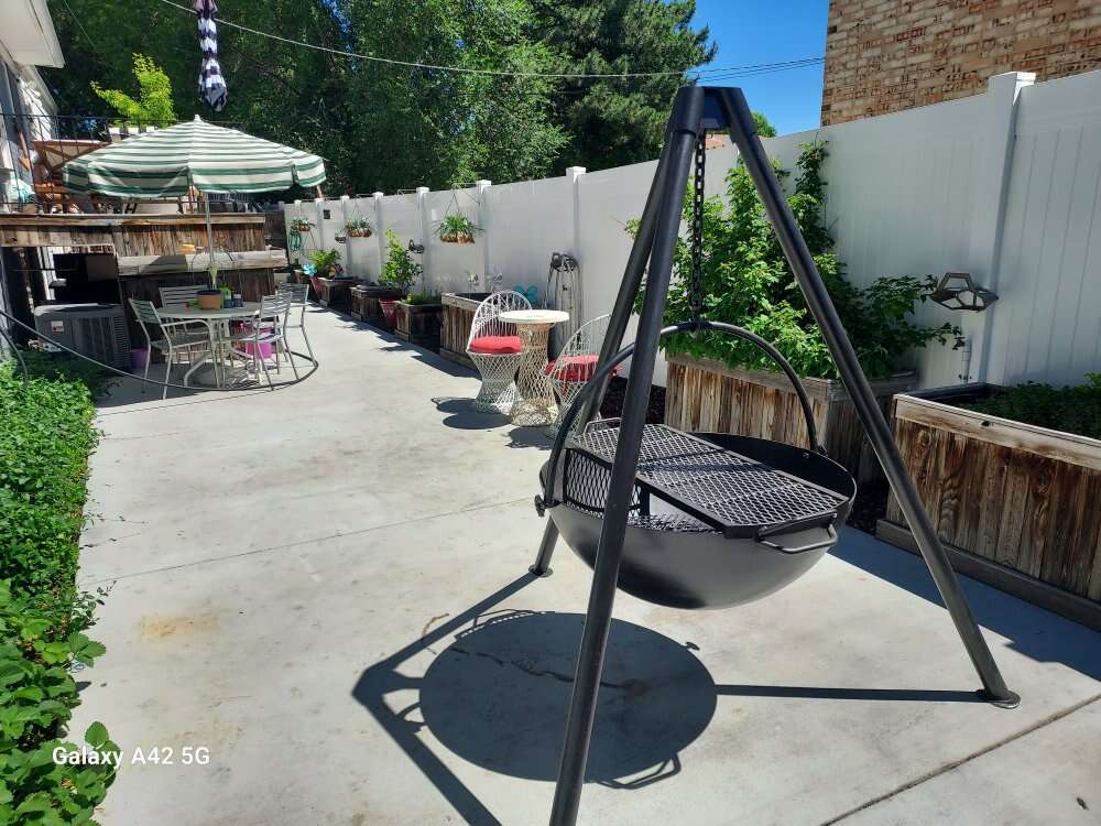 Tripod style hanging firebowl