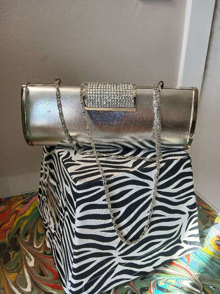 Diva  DNA silver rhienstone studded crossbody hand