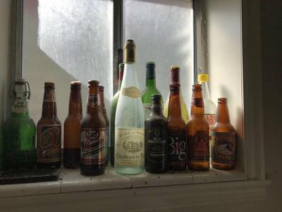 beer and vintage bottle collection cases of different bottles