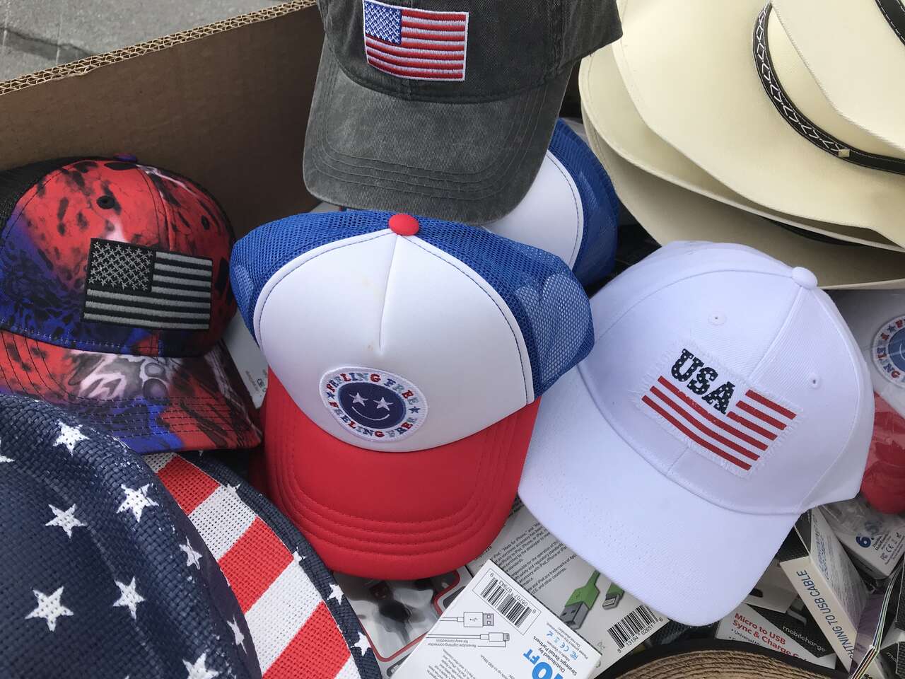 Patriotic ball caps and cowboy hats