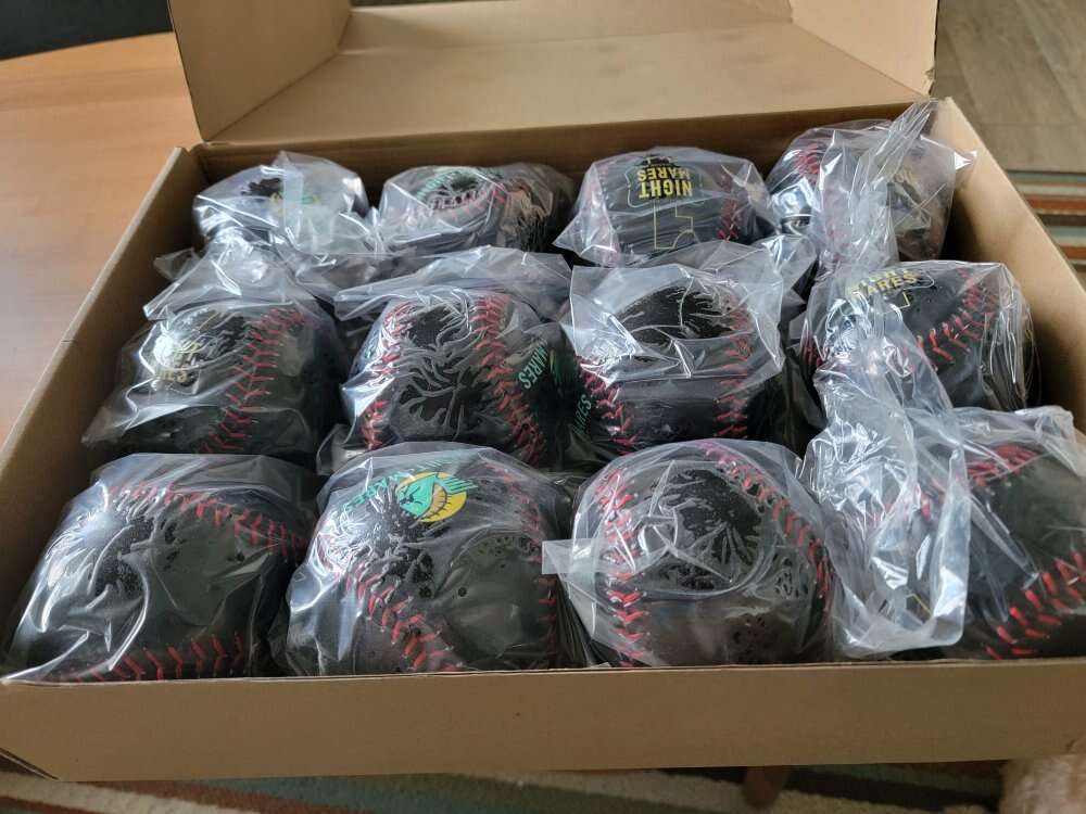 Dozen Black Softballs