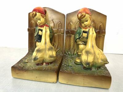 Matching pair of antique Hummel-goebel style chalkware bookends. Boy with dog and girl w geese vintage