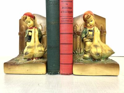 Matching pair of antique Hummel-goebel style chalkware bookends. Boy with dog and girl w geese vintage