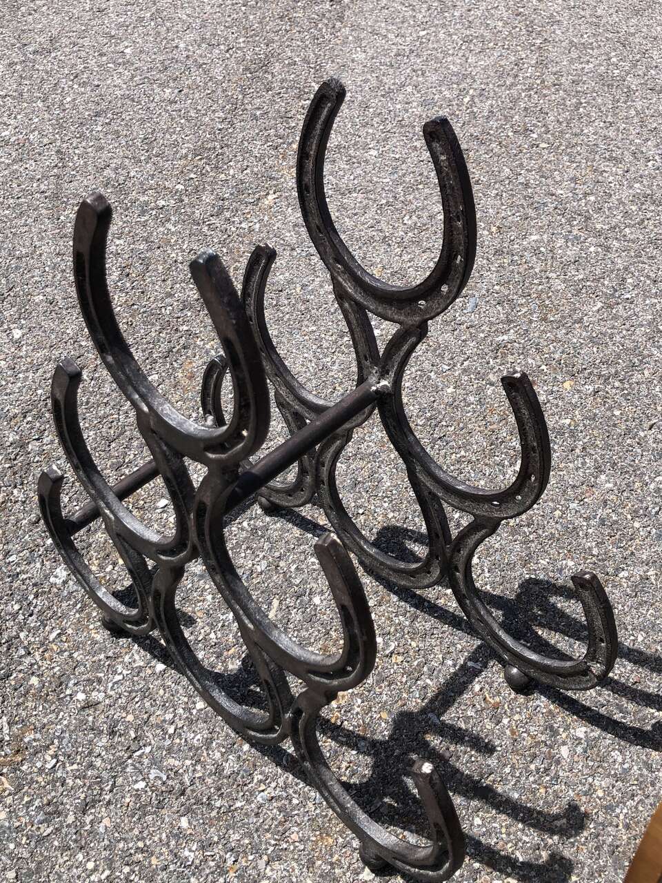 Metal horsshoe wine rack holder perfect gift for the cowboy or cowgirl in your life. Giddy up.  Horse shoes Western