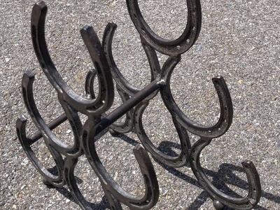 Metal horsshoe wine rack holder perfect gift for the cowboy or cowgirl in your life. Giddy up. Horse shoes Western