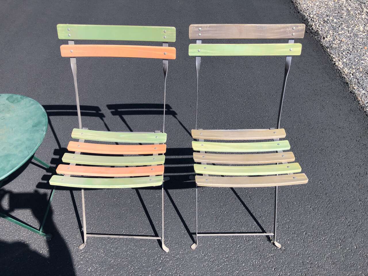 Pair of  French made metal bistro folding chairs. Made in France by Fermob. Sold by Pottery Barn patio deck furniture