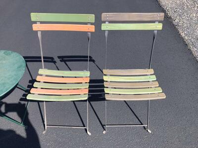 Pair of French made metal bistro folding chairs. Made in France by Fermob. Sold by Pottery Barn patio deck furniture