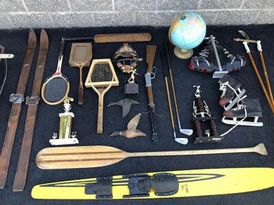 Antique cabin decor, wall hangings, baseball, skis, tennis rackets, ice skates, sleds, golf clubs, trophies, fishing, vintage