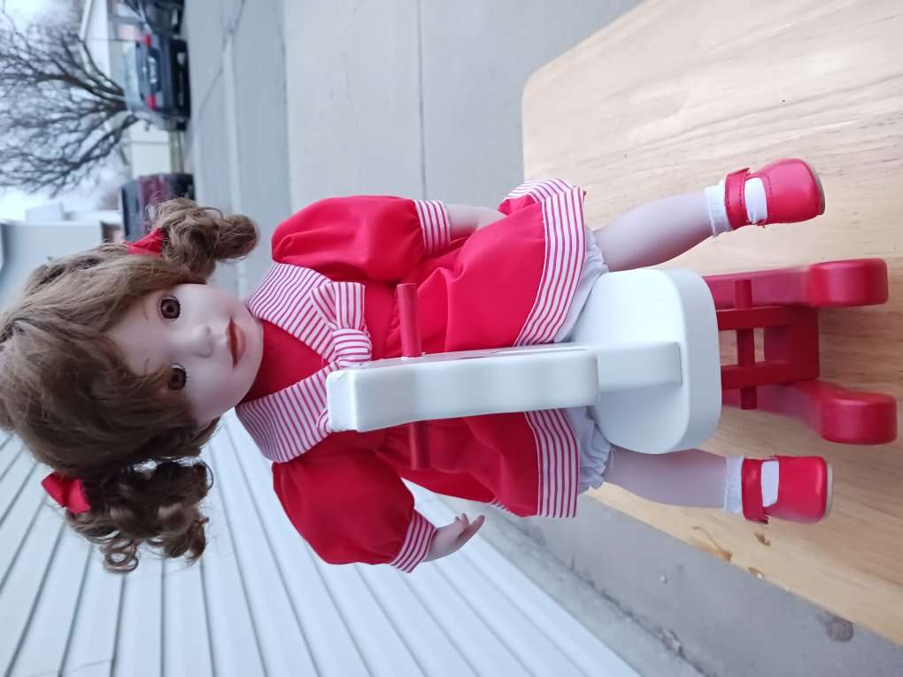 Porcelain Doll with Rocking Horse.