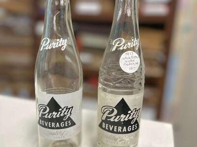 2 Purity Beverages bottles with no chips or breaks