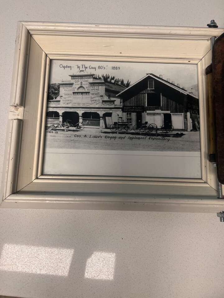 George A Lowe iron cover with glass covered photograph, Ogden Utah