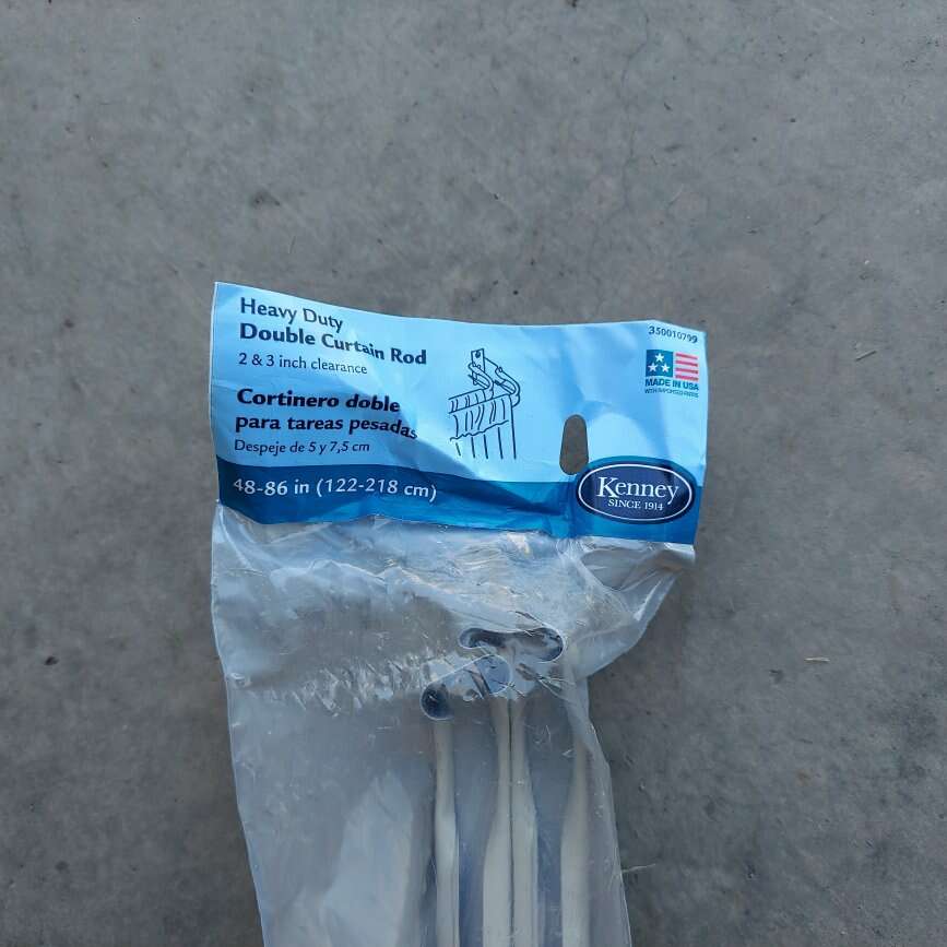 3 new cream colored curtain rods