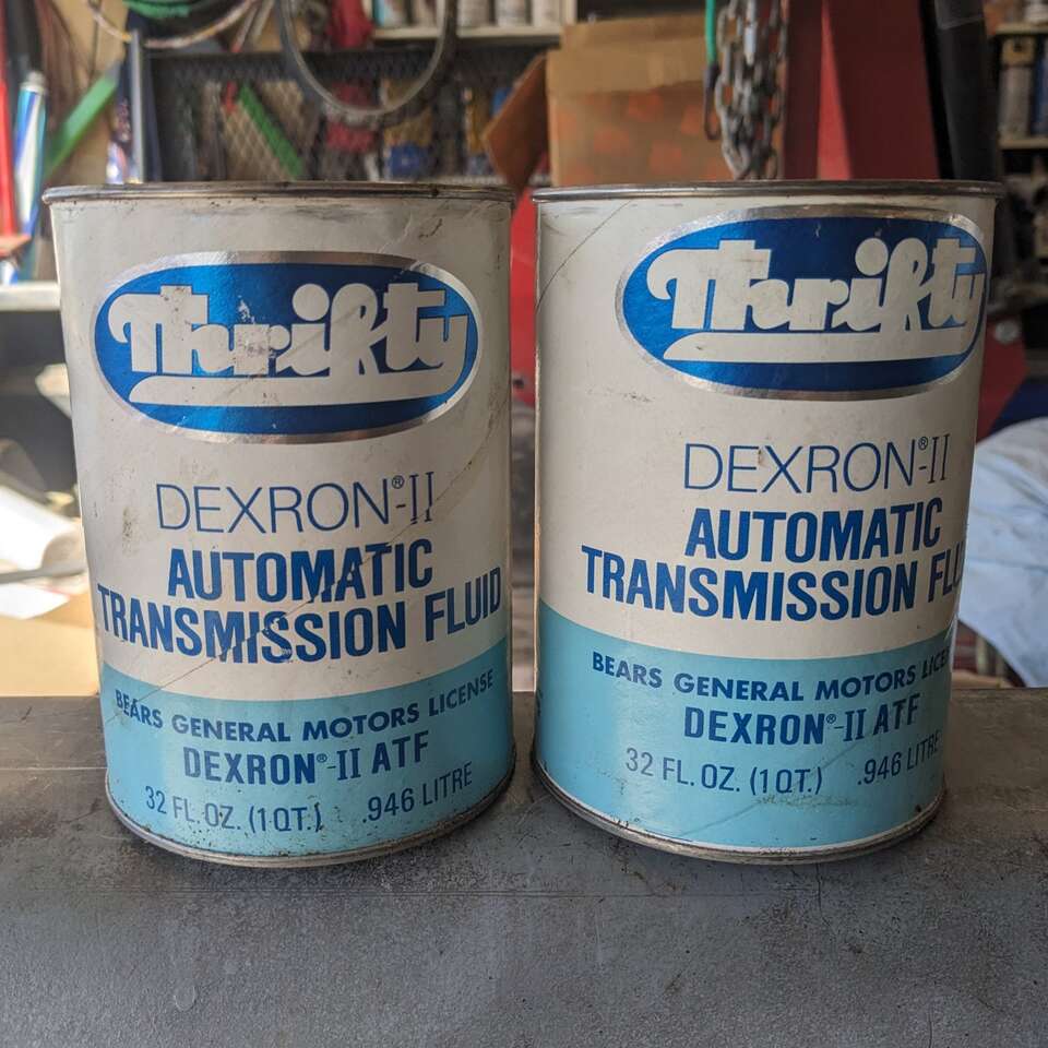 Vintage oil can gas station sign pump