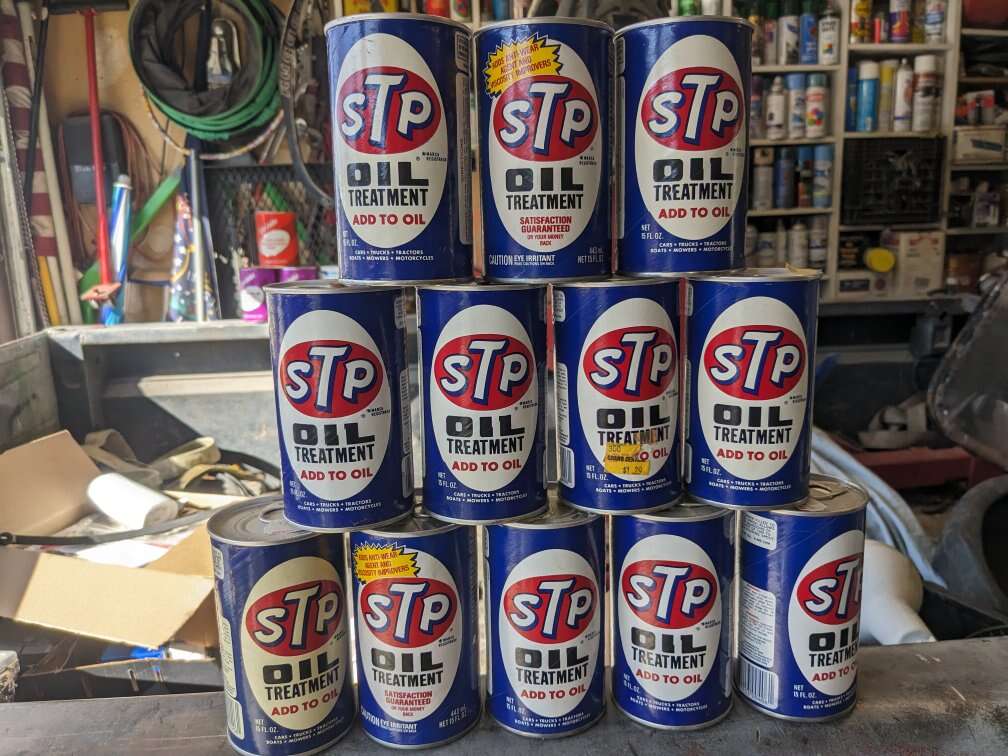 Vintage oil cans STP gas pump station sign utaco