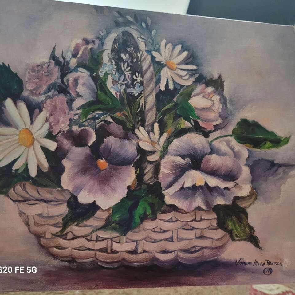 Purple pansies, white daisy in basket