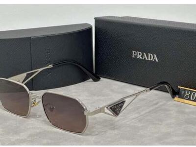 Sunglasses with Prada triangle logo