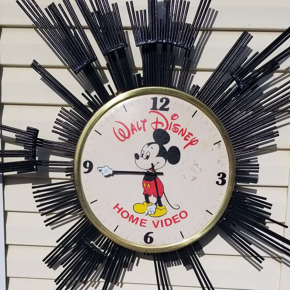 17" Walt Disney CLOCK.Black sun burst not for sale
