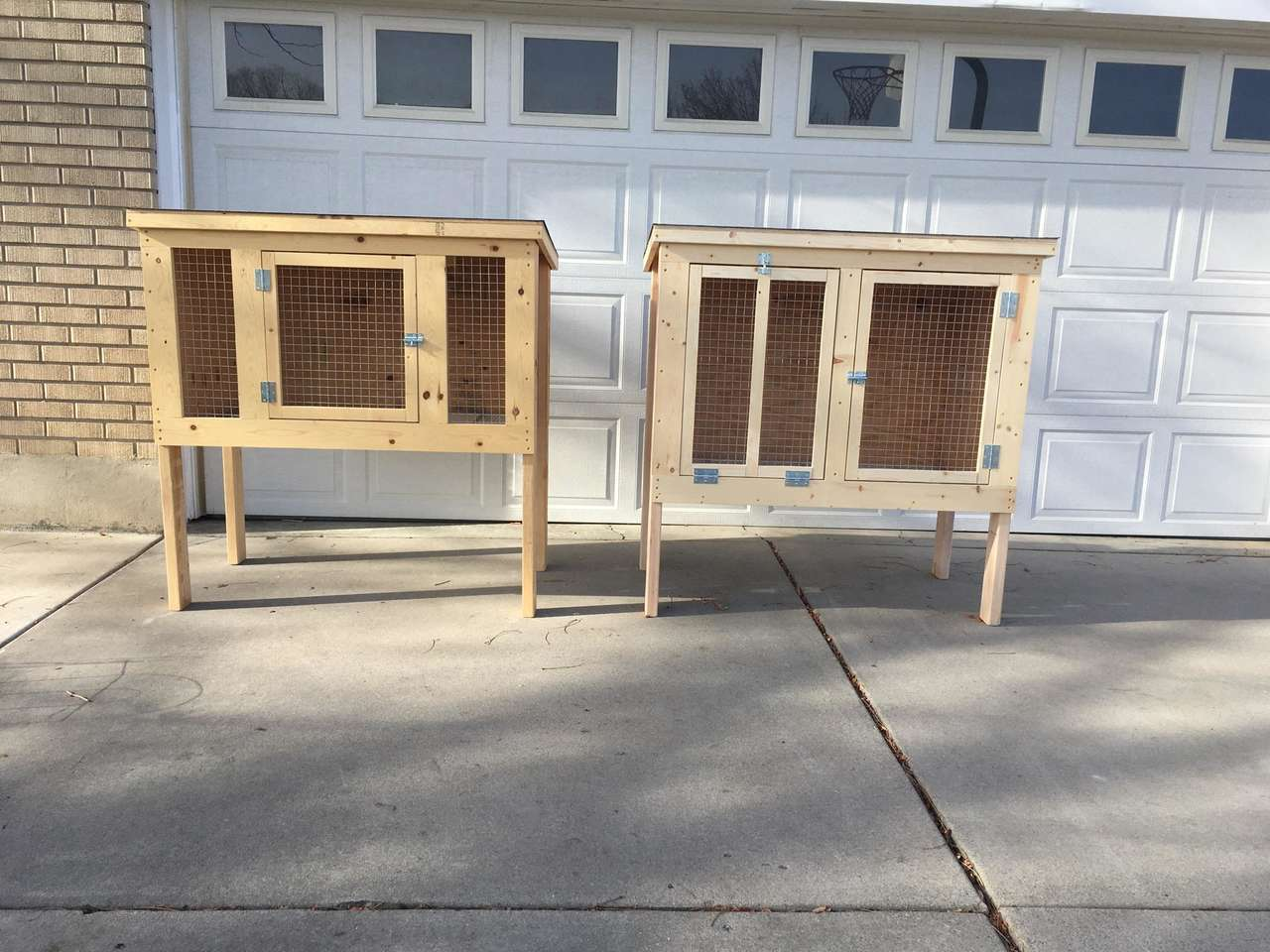 Hand made wooden rabbit pens. One or two doors.