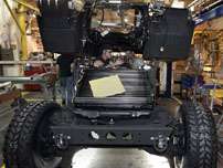 Matt Sheldon, left, and Ralph Kline assemble a refurbished humvee at the Red River Army depot near Texarkana, Texas, in this Monday, May 22, 2005 file photo. The Base Closure and Realignment Commission voted Wednesday to realign the Red River Army Depot in East Texas instead of closing it as recommended by the Pentagon. The army depot works on Humvees and Bradley Fighting Vehicles.