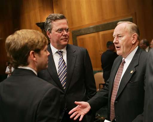 Former congressman James V. Hansen, R-Utah, right, Commissioner of the Base Realignment and Closure Commission (BRAC), speaks with Florida Gov. Jeb Bush, center, and John Peyton, left, Mayor of Jacksonville, Fla., at the Senate Dirksen Office building on Capitol Hill, Saturday, Aug. 20, 2005, in Washington. (AP Photo/Pablo Martinez Monsivais)