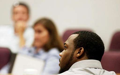 Former BYU football player Ibrahim Rashada listens to William Turner Jr. testify Monday, Aug. 29, 2005, in Provo, Utah. B.J. Mathis and Rashada, both 19, are charged with aggravated sexual assault, dealing harmful material to a minor, furnishing alcohol to a minor and obstructing justice. (AP Photo/Frank Bott, Pool)