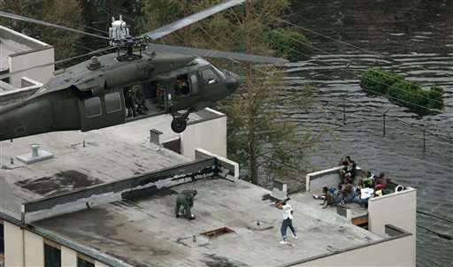 Residents are rescued by helicopter from the floodwaters of Hurricane Katrina Thursday, Sept. 1, 2005, in New Orleans. (AP Photo/David J. Phillip)