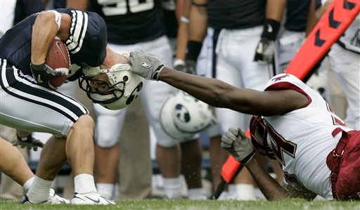 Boston College defensive end Mathias Kiwanuka takes down BYU runningback Nathan Meikle by the helmet during the first quarter Saturday, Sept. 3, 2005, in Provo, Utah. (AP Photo/Douglas C. Pizac)