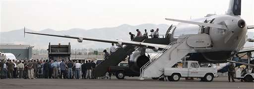 Survivors of hurricane Katrina arrive from New Orleans Saturday, Sept. 3, 2005, in Salt Lake City. (AP Photo/Douglas C. Pizac)