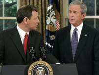 Judge John Roberts, left, looks towards U.S. President Bush after he was nominated as his choice for Supreme Court Chief Justice in the Oval Office of the White House Monday, Sept. 5, 2005, in Washington. President Bush on Monday nominated John Roberts to succeed William H. Rehnquist as chief justice, and called on the Senate to confirm him before the Supreme Court opens its fall term on Oct. 3.