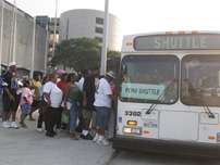 Victims of Hurricane Katrina board a bus bound for a FEMA Disaster Recovery Center located in Houston at the Astrodome Tuesday, Sept. 6, 2005.
