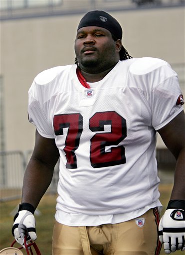 San Francisco offensive lineman Thomas Herrion, 23, walks to practice at the 49ers training camp in Santa Clara, Calif., in this Aug. 9, 2005 photo. (AP Photo/Paul Sakuma)