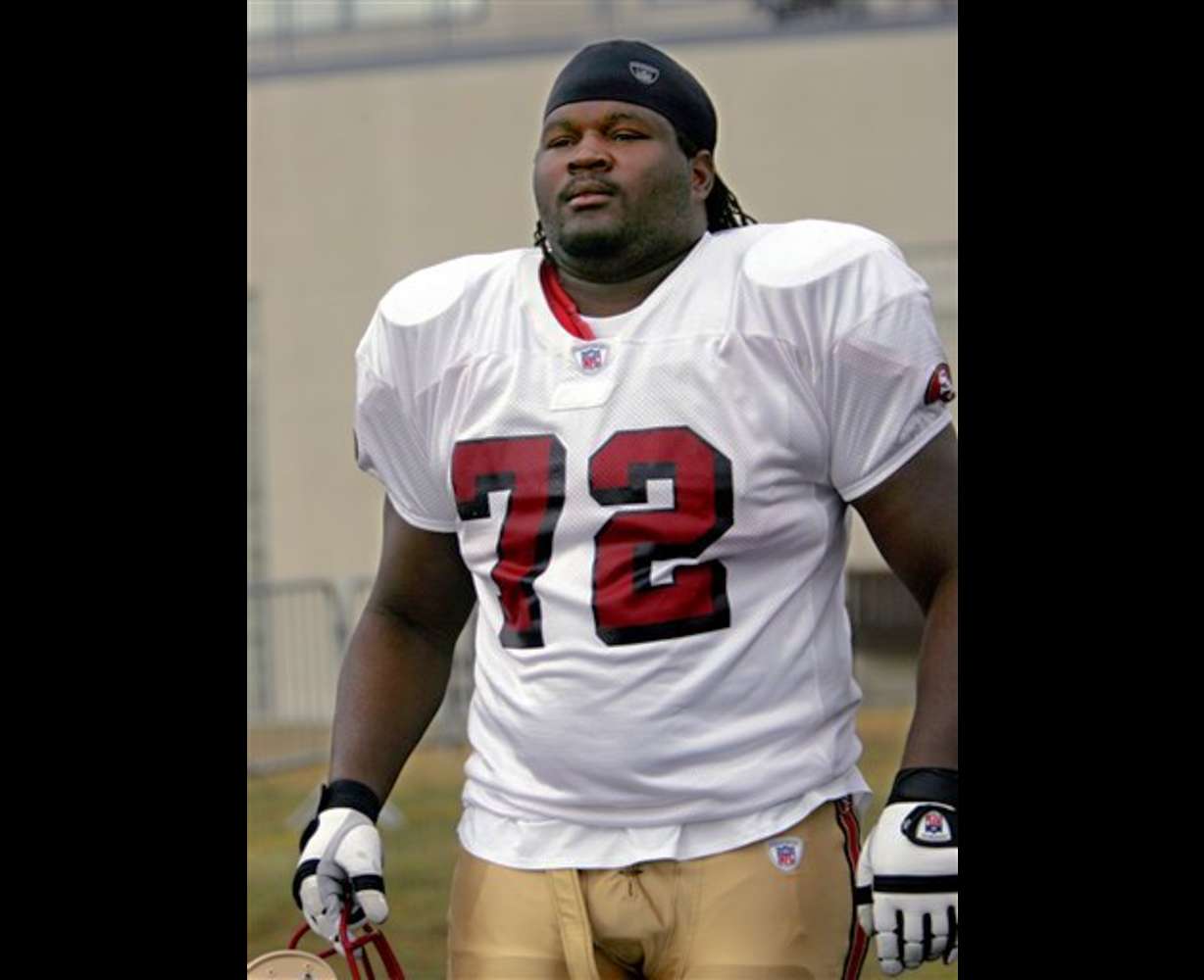 San Francisco offensive lineman Thomas Herrion, 23, walks to practice at the 49ers training camp in Santa Clara, Calif., in this Aug. 9, 2005 photo. (AP Photo/Paul Sakuma)