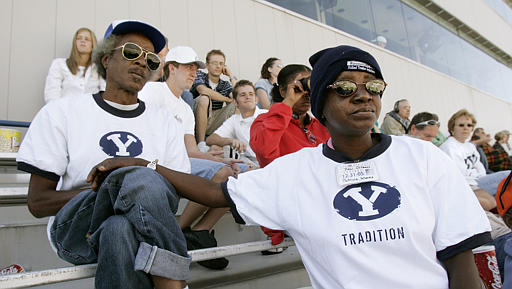 Hurricane Katrina survivors Sandy Price and Patricia Moses of New Orleans watch the Eastern Illinois-Brigham Young game Saturday, Sept. 10, 2005, in Provo, Utah. (AP Photo/Douglas C. Pizac)