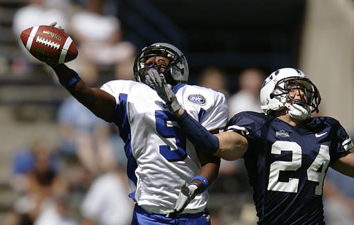Eastern Illinois wide receiver Carles Owens (5) misses a pass as Brigham Young's Spencer White (24) defends during the first quarter Saturday, Sept. 10, 2005, in Provo, Utah. (AP Photo/Douglas C. Pizac)