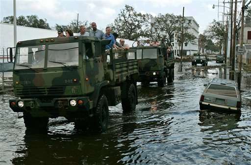 President Bush, joined by Vice Adm. Thad Allen, left, Lousiana Gov. Kathleen Blanco, in red, New Orleans Mayor Ray Nagin, right of Bush, and White House Chief of Staff Andrew Card, second right of Bush, during a tour of downtown New Orleans, Monday, Sept. 12, 2005 damaged by Hurricane Katrina. (AP Photo/Susan Walsh)