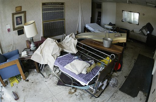 Beds are strewn in the entryway of the Lafon Nursing Home of the Holy Family in New Orleans on Monday, Sept. 12, 2005. Earlier in the day, officials had removed an unspecified number of bodies from the facility, two weeks after Hurricane Katrina struck. (AP Photo/Rick Bowmer)