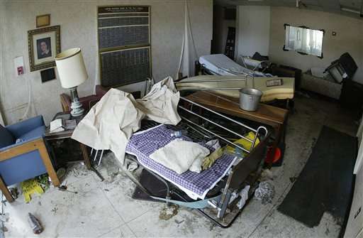 Beds are strewn in the entryway of the Lafon Nursing Home of the Holy Family in New Orleans on Monday, Sept. 12, 2005. Earlier in the day, officials had removed an unspecified number of bodies from the facility, two weeks after Hurricane Katrina struck. (AP Photo/Rick Bowmer)