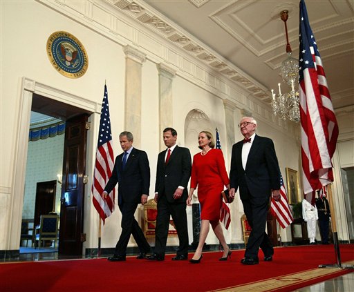 President Bush, Judge John Roberts, his wife Jane, and Supreme Court Justice John Paul Stevens, from left, walk through the Cross Hall to the East Room for Roberts' swearing in Thursday, Sept. 29, 2005, as the 17th Chief Justice of the United States in the White House in Washington. (AP Photo/Charles Dharapak)