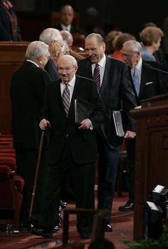 Gordon B. Hinckley, president of The Church of Jesus Christ of Latter-day Saints, arrives for the 175th semi-annual general conference Saturday, Oct. 1, 2005, in Salt Lake City. Following the Mormon prophet are his counselors, Thomas S. Monson and James E. Faust, rear. (AP Photo/Douglas C. Pizac)