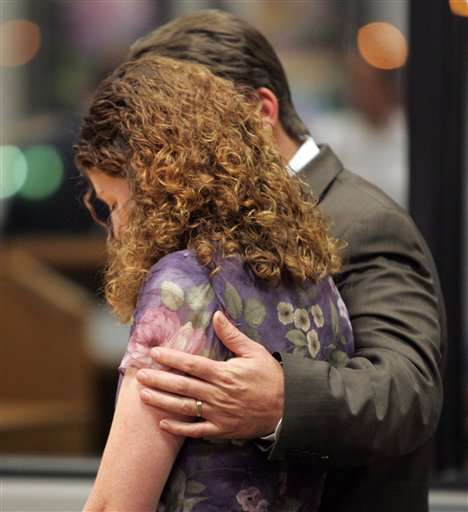 Richard Killpack, right, comforts his wife Jennete after a verdict was returned in the child abuse homicide case against the couple in Utah's Fourth District Court in Provo, Utah, Tuesday, Oct. 11, 2005. The jury found Richard innocent, but convicted Jennete of the charges related to the death of their four-year-old adopted child after they allegedly forced her to drink large amounts of water as a form of punishment. (AP Photo/Jason Olson, Pool)