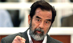 Saddam Pleads Innocent, Gets Into Scuffle