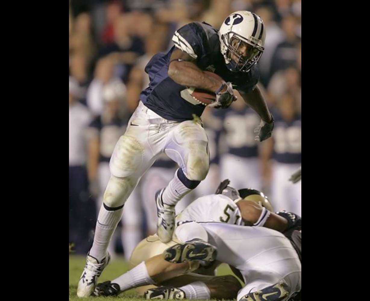 Brigham Young's Curtis Brown runs for a large gain against Colorado State during the first quarter in Provo, Utah, on Saturday, Oct. 15, 2005. (AP Photo/George Frey)