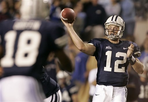 Brigham Young's John Beck (12) passes the ball to Joe Griffin (18) during the first quarter against Colorado State on Saturday, Oct. 15, 2005, in Provo, Utah. (AP Photo/George Frey)