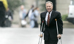 Vice President Dick Cheney's chief of staff, I. Lewis 'Scooter' Libby walks from the White House on crutches, Friday, Oct. 28, 2005, to the Eisenhower Executive Building on the White House compound.