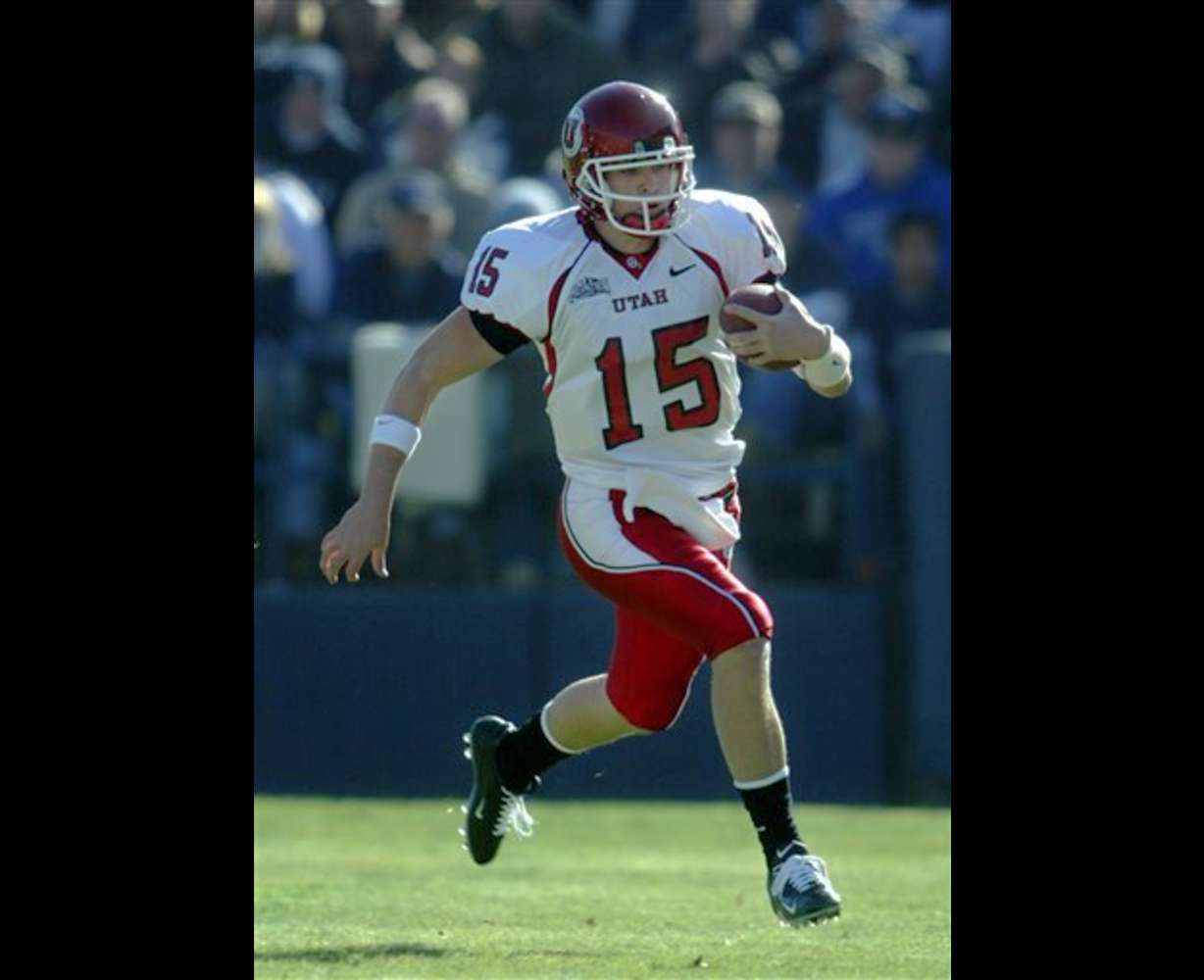 Utah quarterback Brett Ratliff runs the ball downfield against BYU during the first half Saturday, Nov. 19, 2005, in Salt Lake City. Utah beat BYU 41-34. (AP Photo/Steve C. Wilson)