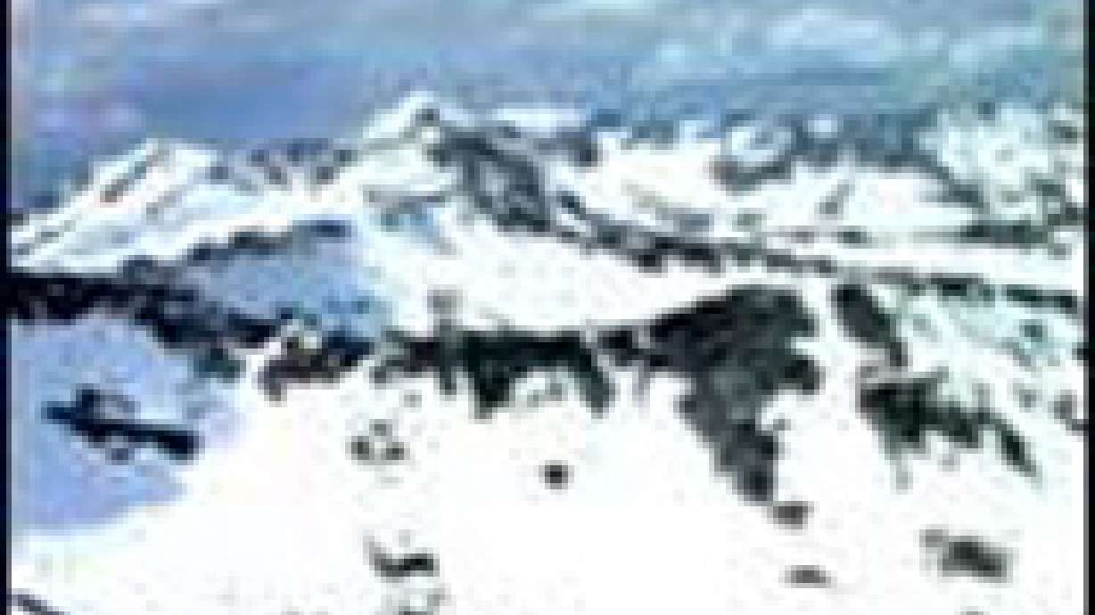 Crews Rescue Injured Snowmobiler